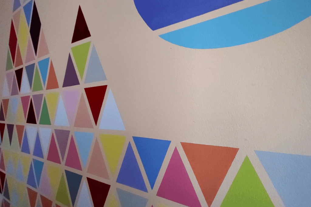 painting mountains on wall with tape