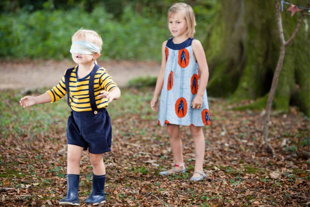 21 Blindfold Games for Kids: Nurture Friendship and Trust 8 blindfold game ideas - kids playing blindfold fetch