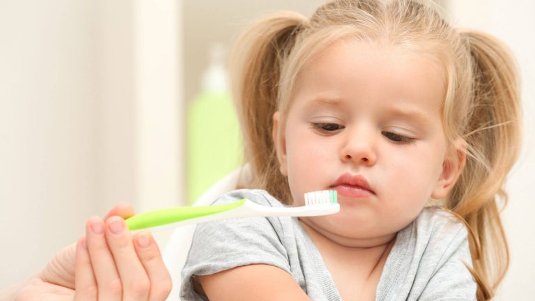 a toddler wont brush teeth image